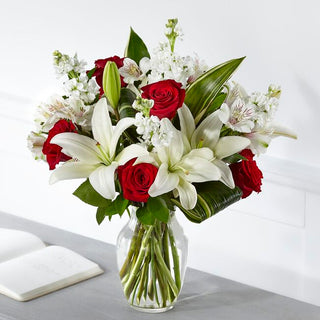 Luxury sympathy flowers in vase with white lilies and red roses – top Toronto florist