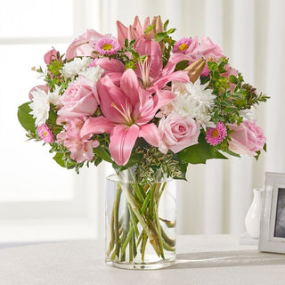 Condolence bouquet with pink lilies and soft white blooms – Thoughtful flower delivery in Durham Region