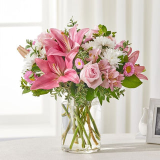 Elegant pink lilies and white sympathy flowers – Hand-delivered to homes in Durham Region for funeral and condolence.