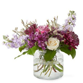 Purple and white flower bouquet arranged in a vase — perfect for birthdays, anniversaries, or sympathy gifts