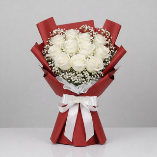 12 white roses wrapped in with a premium red wrapping paper. Best Hand Tied Flower Bouquet in Toronto. Yunza Florist
