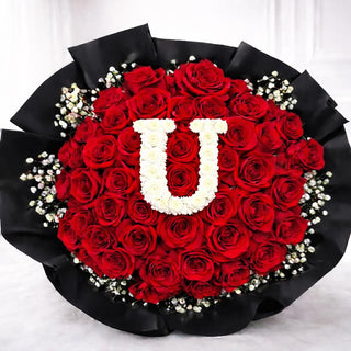 Luxury flower bouquet with red roses and personalized pompom letter