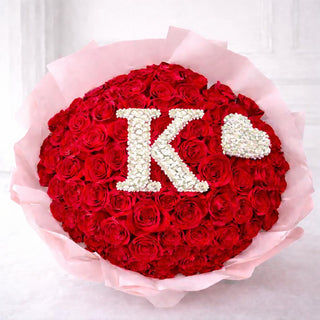 Custom floral letter gift with fresh red roses and baby’s breath