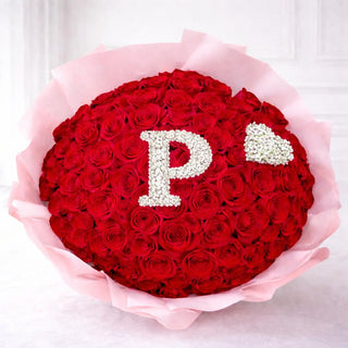 Elegant alphabet flower bouquet wrapped in pink paper