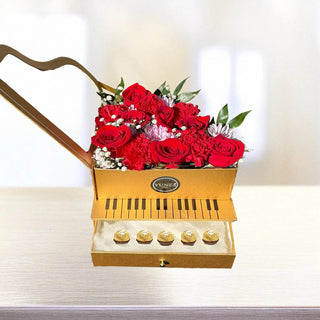 Turn any moment into a grand gesture with our one-of-a-kind Romantic Piano Flower Box, a signature piece from YUNZA Florist. Designed to resemble a golden piano, this elegant box opens to reveal a lush arrangement of vibrant red roses, carnations, and seasonal blooms — paired perfectly with a hidden drawer of Ferrero Rocher chocolates.
