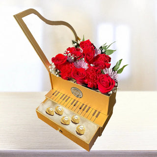 Make a lasting impression with this stunning Piano Flower Box, exclusively from YUNZA Florist Toronto. This luxury floral gift features a beautiful arrangement of fresh red roses, carnations, and accent blooms, creatively displayed in a piano-shaped box — complete with a hidden drawer of Ferrero Rocher chocolates.