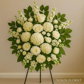 Elegant standing spray of white hydrangeas, roses, and poms — a pure, heartfelt tribute handcrafted by Yunza Florist. Same-day delivery in Toronto & GTA.