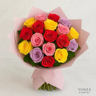 25 mixed roses bouquet featuring red, yellow, pink, and lavender roses wrapped in pastel Korean-style paper with satin ribbon, handcrafted by Yunza Florist Toronto