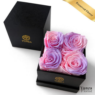 Four pink and purple preserved roses in a luxury black gift box by Yunza Florist for same-day delivery in Toronto and the GTA.