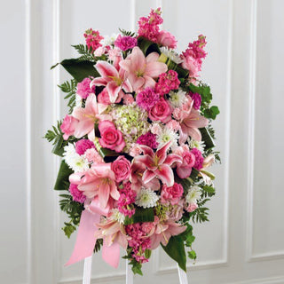 Condolence standing spray flower arrangement with pink lilies and lavender accents