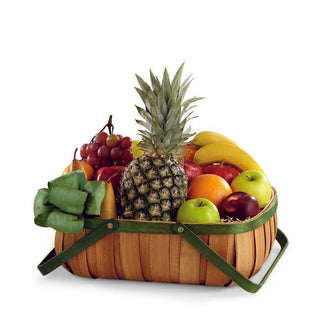 Assorted seasonal fruits in a ribboned basket, ready for same-day delivery in Toronto and the GTA