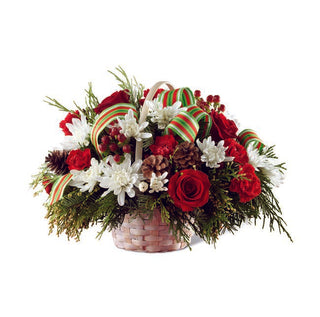 Winter-themed flower arrangement with rich colors and fresh greens