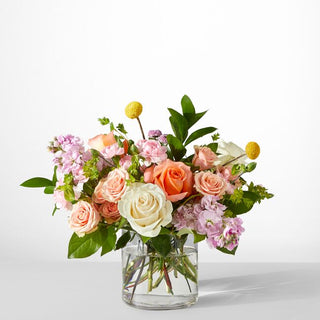 Romantic pastel bouquet with roses, lavender stock, and white blooms — floral arrangement ideal for anniversaries and weddings