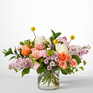 Modern glass vase bouquet with pastel roses, lavender stock, and greenery — light and elegant arrangement by Yunza Florist