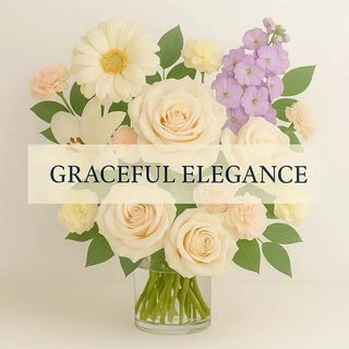 Graceful Elegance bouquet with ivory roses, daisies, lilies, carnations, and seasonal flowers in a clear vase – Yunza Florist Toronto
