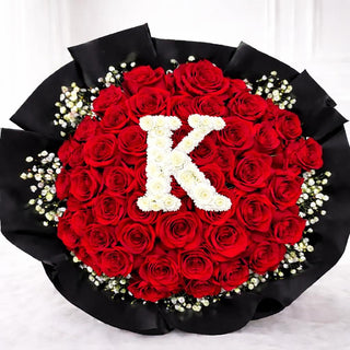 Round red rose bouquet with personalized floral letter centerpiece