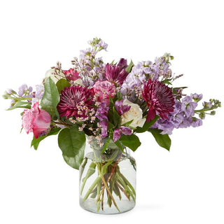 Fresh floral arrangement of lavender, pink, and ivory roses with lush greens, handcrafted for same-day delivery in Toronto