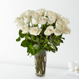 24 long stem white roses in a glass vase with fresh greenery – Toronto flower delivery by Yunza Florist