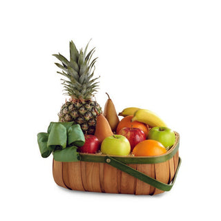 Classic fruit gift basket—pineapple centered with apples, oranges, bananas, grapes and pears