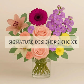 Signature Designer’s Choice bouquet with roses, lilies, gerbera daisy, carnations, and seasonal flowers in a clear vase – Yunza Florist Toronto
