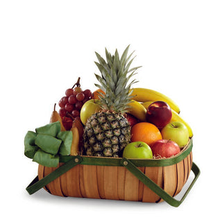Gourmet fruit basket featuring pineapple and mixed apples, oranges, pears, grapes and bananas