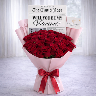 Luxury red rose Valentine bouquet with newspaper front page card and pink wrapping by Yunza Florist Toronto
