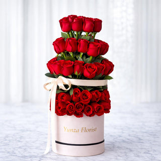 Tower of 50 red roses in a tall box for Valentine’s Day flower delivery in Toronto