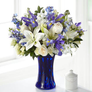 Send heartfelt condolences with all-white sympathy flowers featuring roses and lilies. Perfect for funerals and memorials in Vaughan.