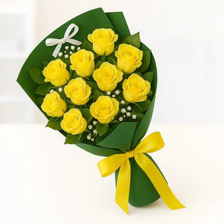 A bouquet of 10 natural yellow roses with baby's breath, wrapped in soft green paper and tied with a yellow satin ribbon. Available for same-day delivery in Toronto and the GTA